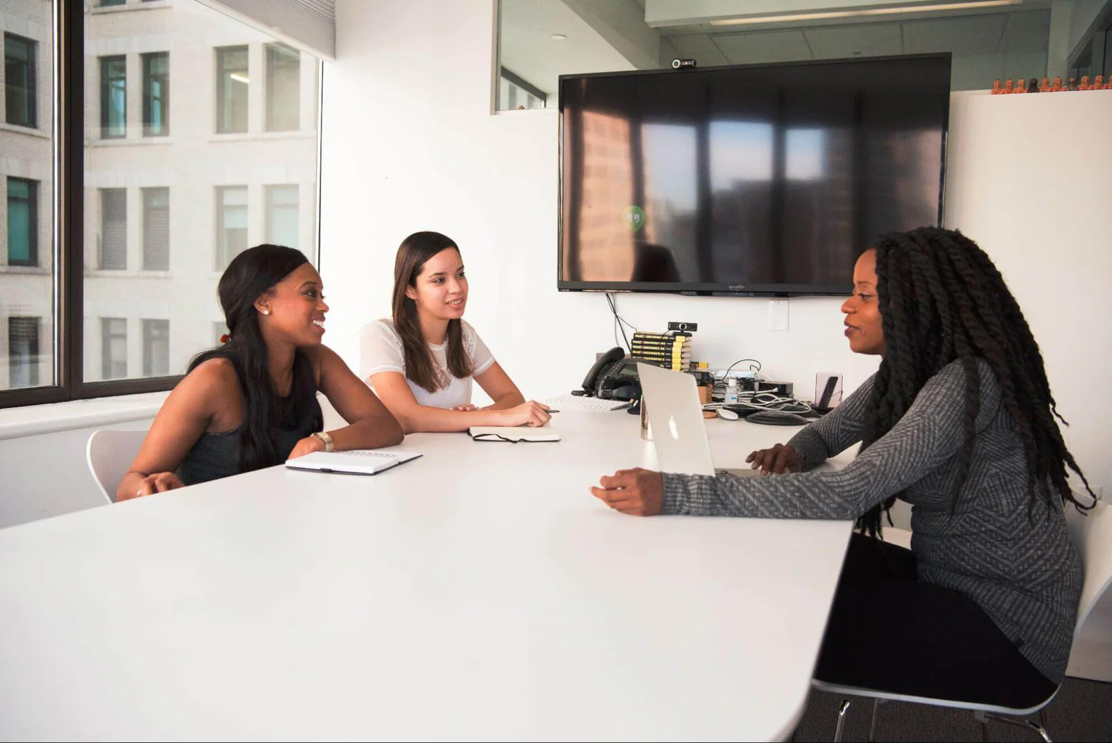 Private consultation room with comfortable seating and financial planning materials